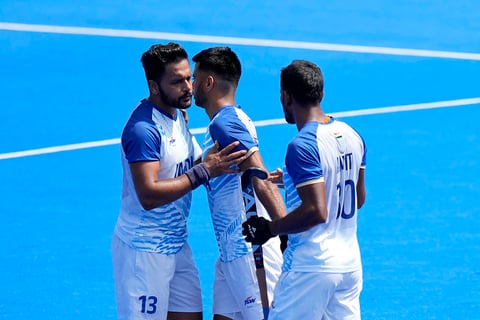 Harmanpreet Singh celebrates scoring his side's first goal during the men's bronze medal match between India and Spain